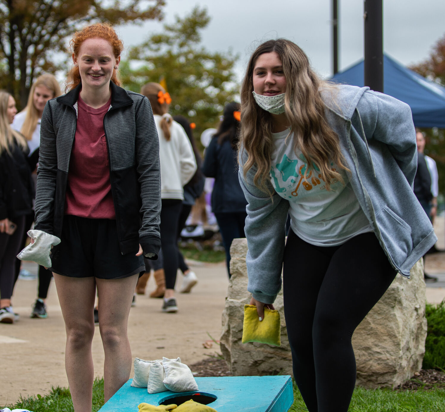 Students play cornhole at THON 5K